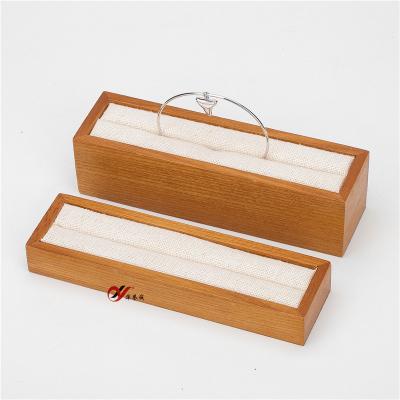 China Solid Wood Jewelry Display Stands For Ring / Bracelet with Yellow Linen for sale