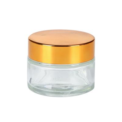 China Personal Care Luxury Clear Lotion Bottles Transparent Cosmetic Packaging Cream Jar 20g 50g With Gold Cap for sale