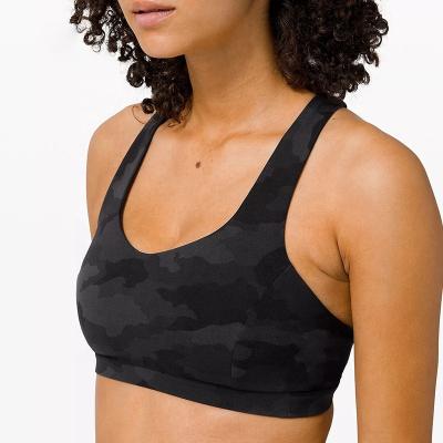 China Breathable Cross Back Sports Bras Tops Yoga Wear Gym Clothing Camouflage Sexy Yoga Gym Bra for sale