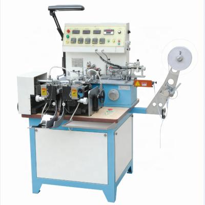 China Multifunctional high-speed printed fabric label satin ribbon cutting and folding machine garment care label cutting machine JZ2817 for sale