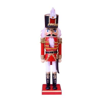 China Christmas Tree Decoration 36 cm Feather Machete Red King Nutcracker Wooden Nutcracker Christmas Decoration for sale