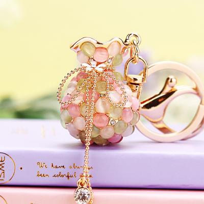 China Key Chain Dangle Ring Gift Metal Keychain Hot Korean Creative Bag Promotion Sale Moonstone Border Lucky Bag Car Keychain Female for sale