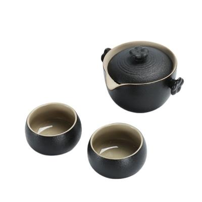 China Durable Pottery Black Stone Glazed Tea Set With One Pot And Two Cups Travel Portable Tea Set for sale