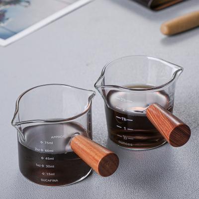 China Sustainable High Temperature Resistant Creative Double-mouth Glass Measuring Cup For Milk Coffee for sale