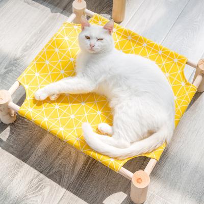 China Portable Cooling Wooden Cat Hammock Cooling Bed with Washable Cotton Cat Bed Raised Dog for sale