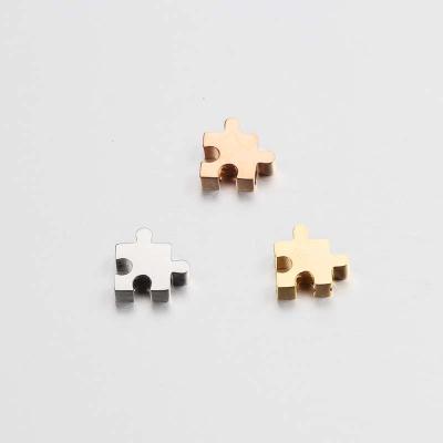 China Environmental Friendly Stainless Steel Charms Mirror Polished Puzzle Charms For Jewelry Making for sale