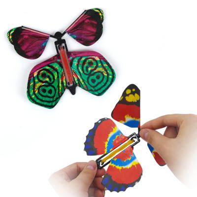 China Flying Toy Paper Butterfly Worked By Durable Magic Rubber Band Tricks Fun Funny Mystical Surprise Joke Change Hands Prank Plastic Hook for sale