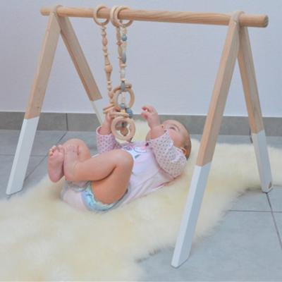 China Toy Winning Wholesales Eco-Friendly Beech Educational Wooden Baby Gym with 4 Felt Foldable Activity Gym Frame Gym Toys Baby Hanging Toy for sale