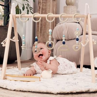 China Eco-Friendly Ring Baby Chewable Rattle Teether Gift Play Gym Decorative Gain Wooden Newborn Toys With Tassels for sale