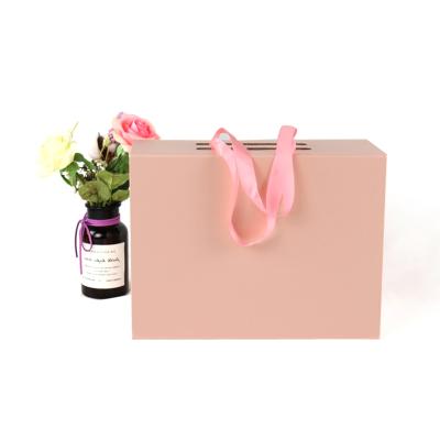 China Luxury and Beautiful Rigid Materials Closure Recycled Paper Magnetic Gift Box, Pink Folding Style Packaging Box for sale