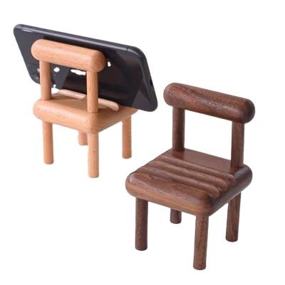 Chine Nouveau porte-téléphone en bois en hêtre porte-tabouille créatif petit porte-tabouille bureau porte-téléphone portable pour les paresseux à vendre