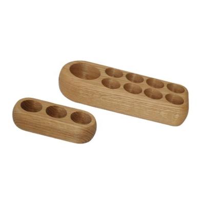 China Nieuwste houten flessen voor essentiële olie Display Stand Op maat gemaakt Houten basis Solid Hout Oval vorm Houder Te koop