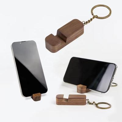 China Walnut Wood Keychain Phone Holder Multifunctional Key Ring Gift for sale