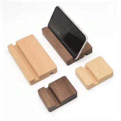 China Estante para teléfonos celulares de madera Portador de teléfonos móviles de madera Universal portátil de escritorio Estante para teléfonos inteligentes en venta