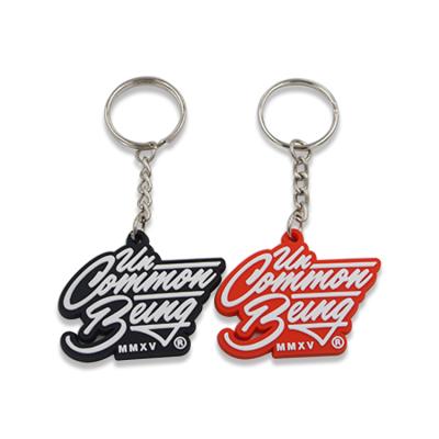 China Custom Advertising JS PVC Soft Plastic Black Key Holder Personalized Logo Fashion Keychains for sale