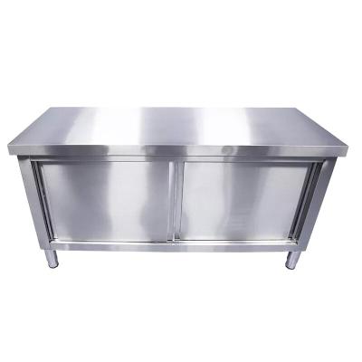 China Modern Simple Hotel Restaurant Heavy Duty Stainless Steel Double Doors Storge Kitchen Table Steel Work Bench With Sliding Door for sale