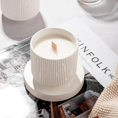 China 2023 Unique Ceramic Wooden Wick Wax Pillar Shape Pillar Jar Scented Oil Fragrance Candle for sale