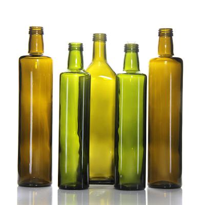 Cina Contenitore di bottiglia di olio di oliva in vetro verde ODM con testa pompa 17 oz in vendita