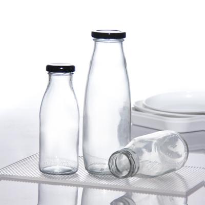 China OEM 250 ml 500 ml 1000 ml 2 liter glazen melkflessen Kruk voedselkwaliteit Ronde vorm Te koop