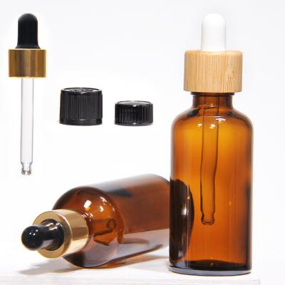 China Customized Hot Stamping 2oz Glass Dropper Bottles With Plastic Lid for sale