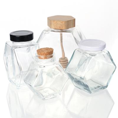 China 100ml 220ml Hexagonal Glass Food Jars With Lids Dipper For Honey for sale