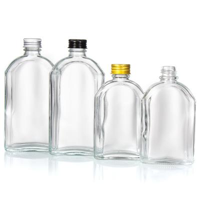 China Personalized Custom 350Ml 500Ml Flat Transparent Liquor Glass Flat Bottle With Aluminum Lid for sale