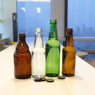 China Hoge kwaliteit groen Amber Bier Glasfles Helder Warm Stampen Drank voor Bier Te koop