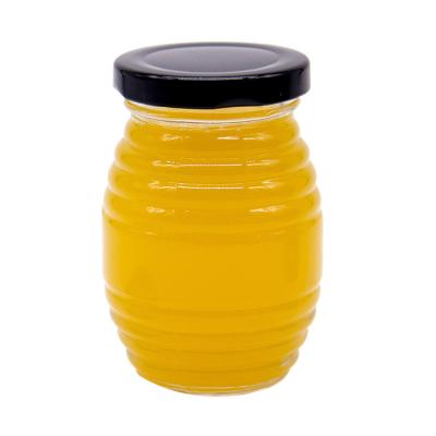 China Custom Logo Full Size Clear Honey Wide Mouth Glass Food Jars With Lids for sale