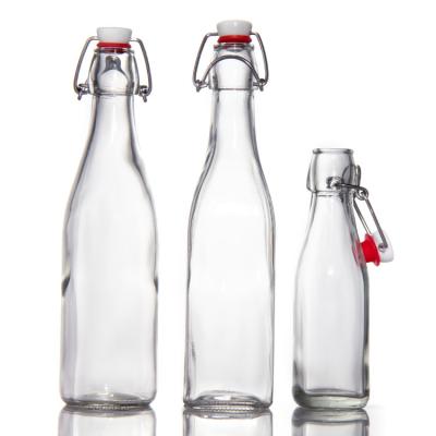 China Custom Design Glass Bottles 200Ml 250Ml Juice Glass Bottles With Swing Top for sale