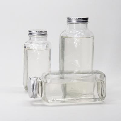 China Glass Juice Bottles Squared Juice Glass Bottles With Tamper Proof Cap For Juice Beverage Packaging for sale