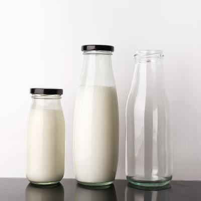 China 200Ml 250Ml 500Ml Transparent Clear Iced Drinks Milk Glass Bottles With Lid for sale