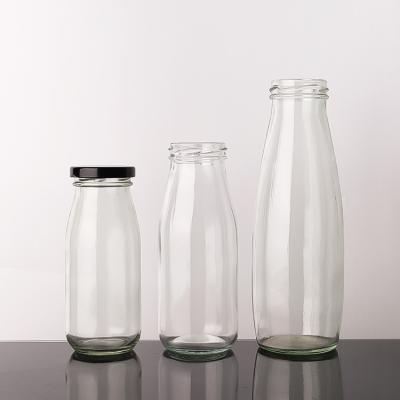 China Free Sample 100Ml 200Ml 350Ml Pasterurization Cold Brew Tea Milk Glass Bottles With Metal Lid for sale