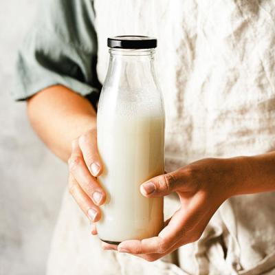 China Gekleurde logo 32 oz 1 liter warmtebestendige flessen voor het leveren van melk Te koop