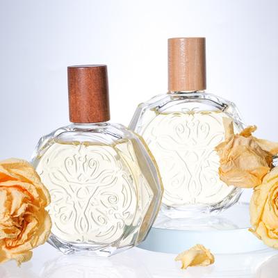 Chine Bouteilles de parfums en verre personnalisées avec bouchons Remplaçables en verre congelé Spray bouteille de parfum à vendre