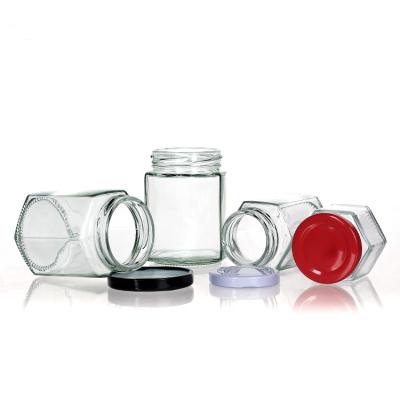 China Clear Bottle Jars With Lids Hexagon Glass Storage Jar For Tea Canister for sale