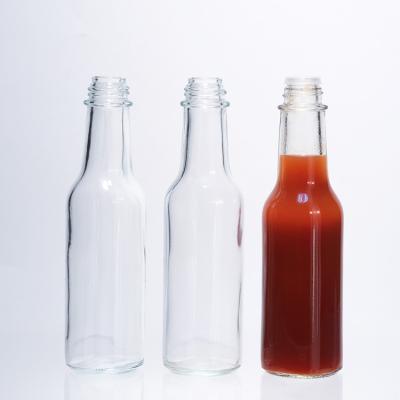 China Empty  Hot Sauce Glass Bottle For Salad Sauce Ketchup Bottle With Lids for sale