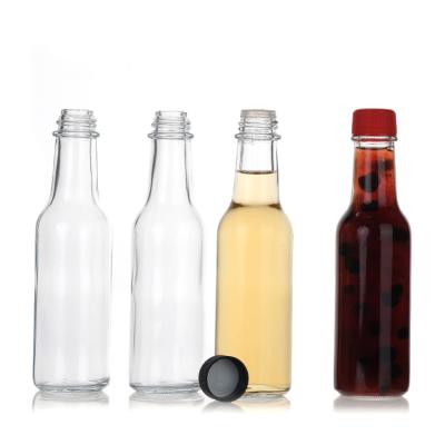 China Cylinder Hot Sauce Bottles 5oz with Caps and Dripper Inserts Woozy Glass Bottle for sale