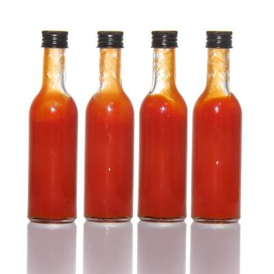 China Mini Empty Chilli Tomato Hot Sauce Bottles with Plastic Lid for sale