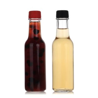 China 150Ml 250Ml 5Oz Woozy Salad Hot Sauce Glass Bottles Mini With Leakproof Black Cap for sale