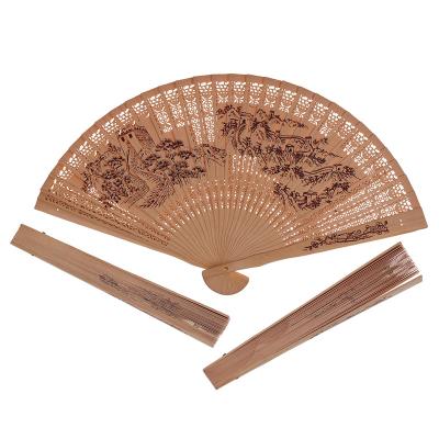 China China Vintage Handmade Bamboo Fans Wedding Gift Folding Wooden Hollow Carved Fan for sale