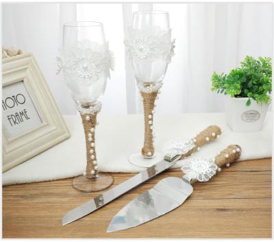 China New Fashional Style Wedding Knife And Cake Server Set Knife Shovel Wine Glass Set Resin Steel Handle With Peral Burlap for sale