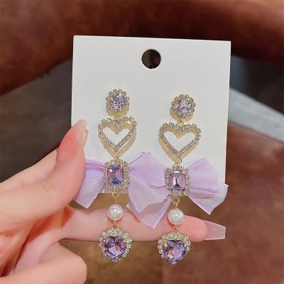 China Fashion 925 needle fashion purple silver bow earrings simple temperament love earrings light up high sense luxury earrings for sale