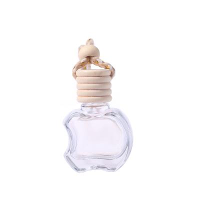 China Wholesale Eco-Friendly Recyclable 8ml Empty Apple Shaped Air Freshener Empty Bottle Cap Wooden Hanging Car Perfume Bottle for sale