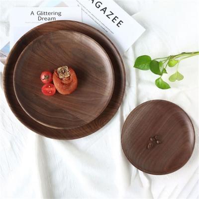 China natural & Wholesale Handmade Eco-Friendly Cake Health Craft Black Walnut Round Restaurant Wooden Serving Dishes for sale