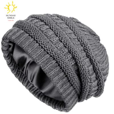 China COMMON COMMON Factory Customized Winter Knit Beanies For Women Satin Striped Chunky Cap Mens Soft Slouchy Thick Warm Cable Hat for sale