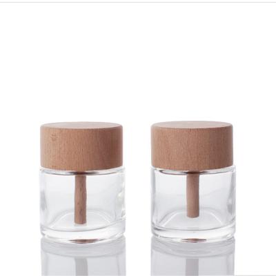 China Gift & Custom craft 50ml 100ml aromatherapy glass bottle round tubular glass diffuser bottle with wooden lid for sale for sale