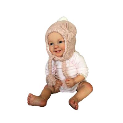 China Sit Wholesale Soft Silicone Lifelike Smiley Realistic Reborn Dolls Baby with Two Milk Teeth for sale