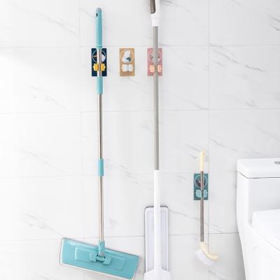 China Cartoon paste hook Wall Hanger Tool toilet strong traceless wall hanging storage load-bearing mop clip for sale