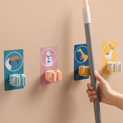 China Mop Rack Broom Card Holder Mop Hook Strong And Seamless Without Punching Mop Clip Bathroom Wall Cartoon Sticky Hook for sale