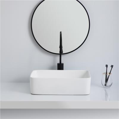 China Modern Sanitary Ware Handmade Table Top White Ceramic Sink Above Art Counter Basin for sale